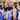Young players huddled during a basketball game at Royal Basketball School.